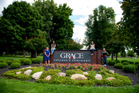 Students with Grace Sign