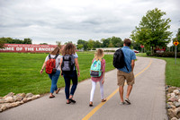 Students Walking by Fields